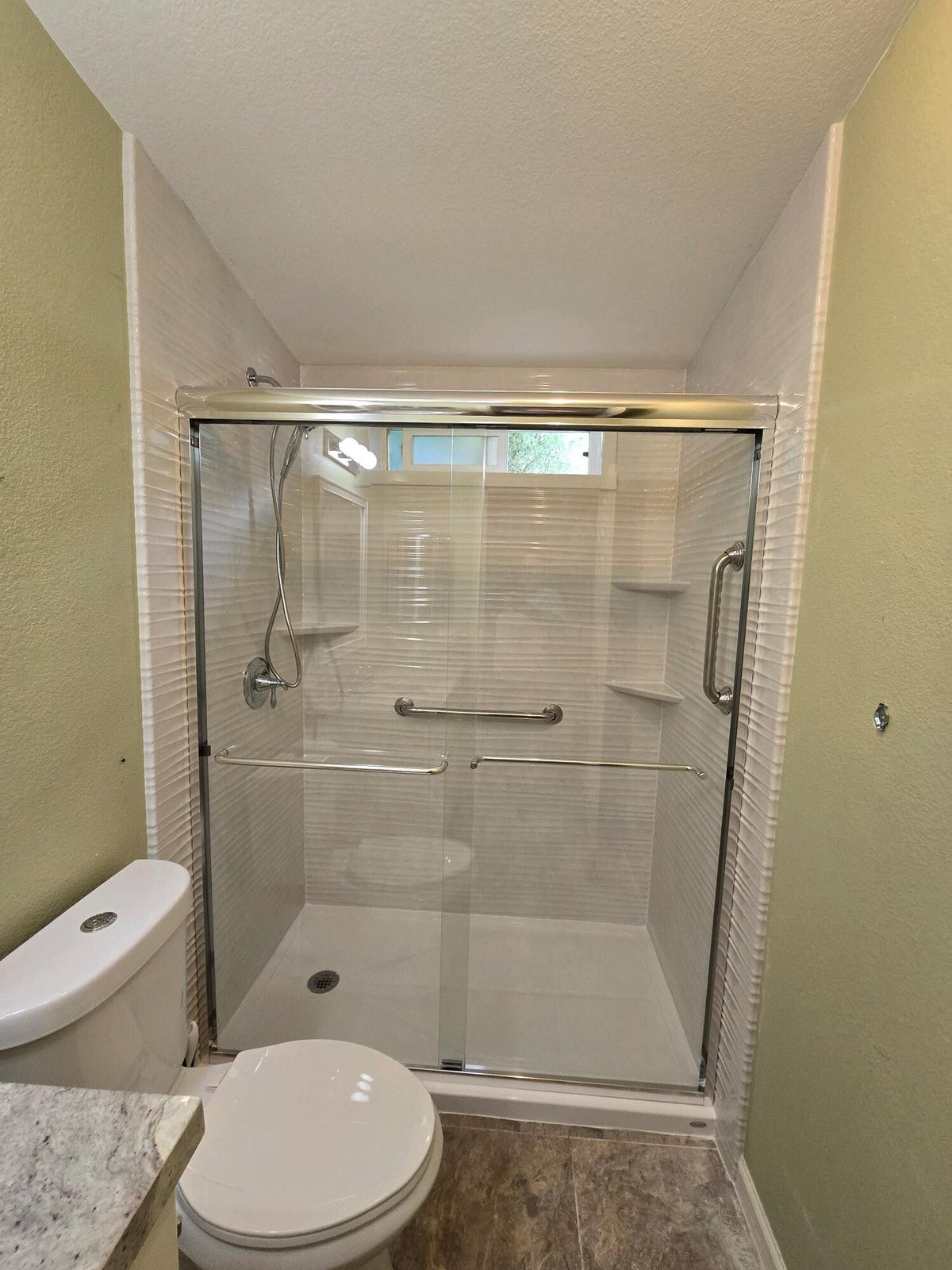 Tub converted to a walk-in shower, after