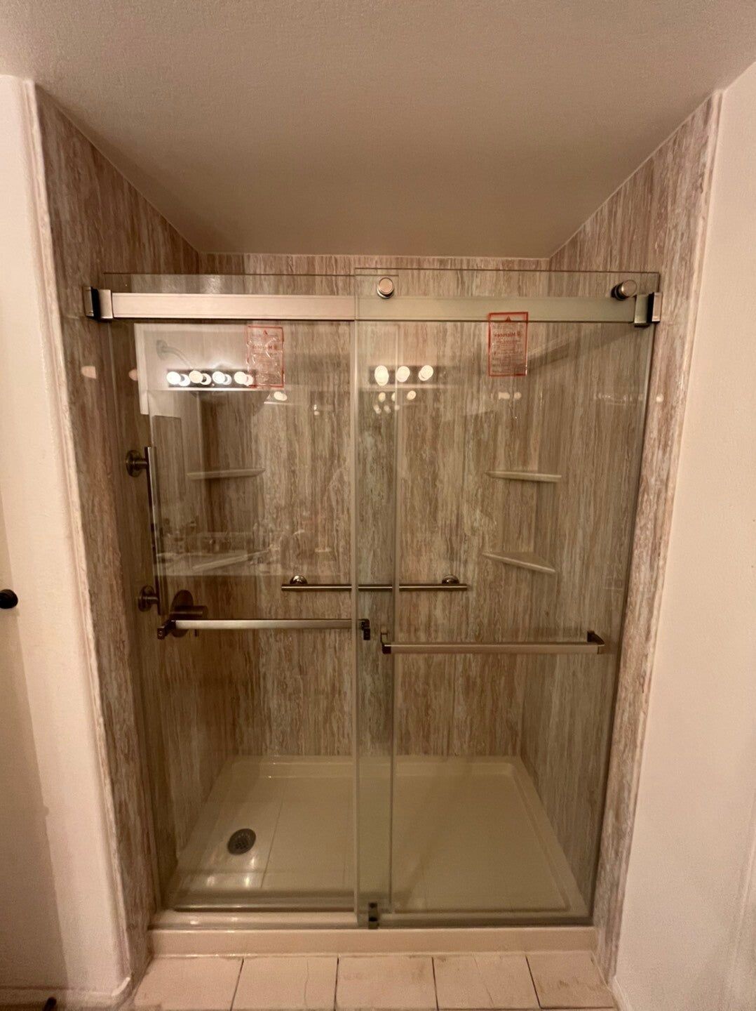 Tub replaced with a stone-look shower, after
