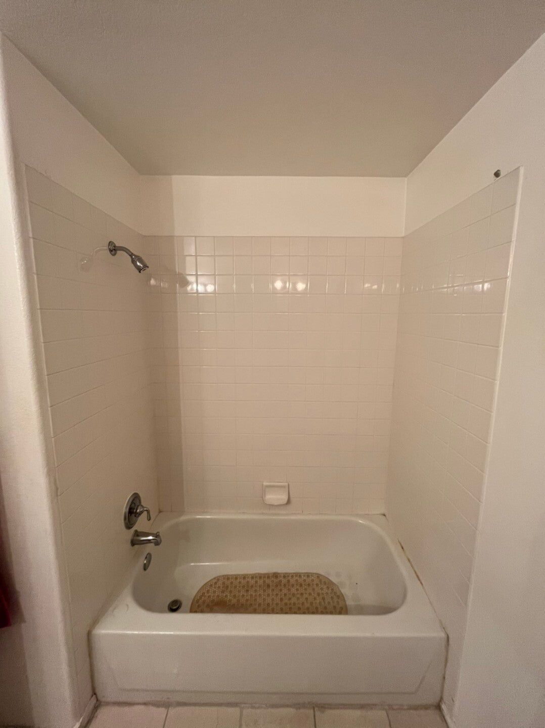 Tub replaced with a stone-look shower, before