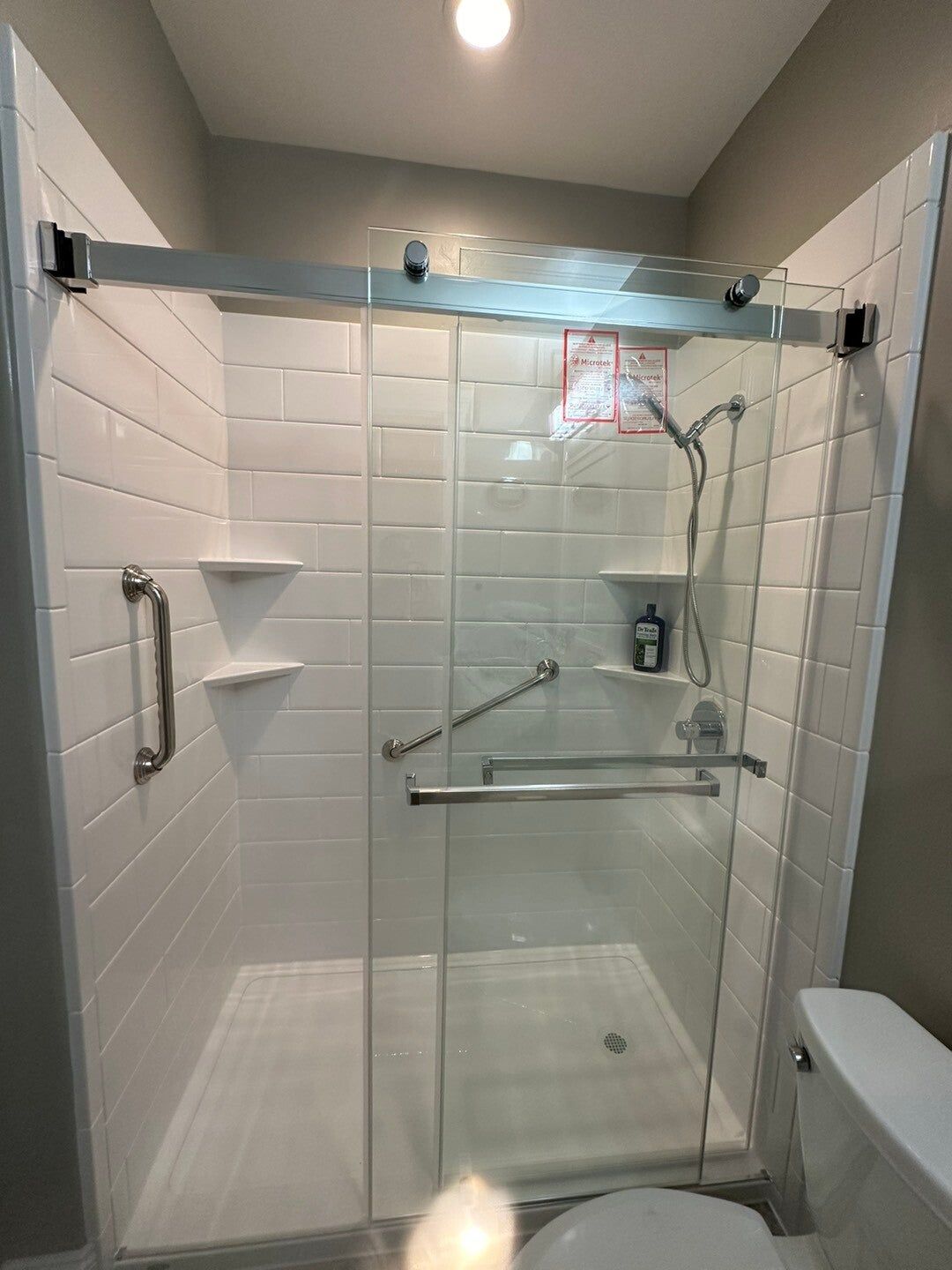 Tub and shower with subway-tile walls, after