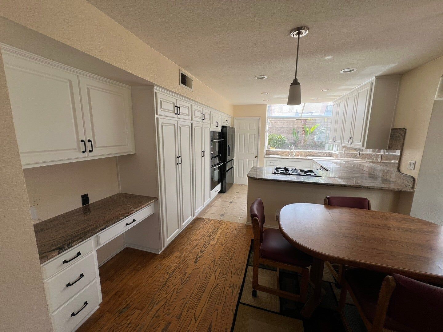 Honey oak kitchen refaced in white, after