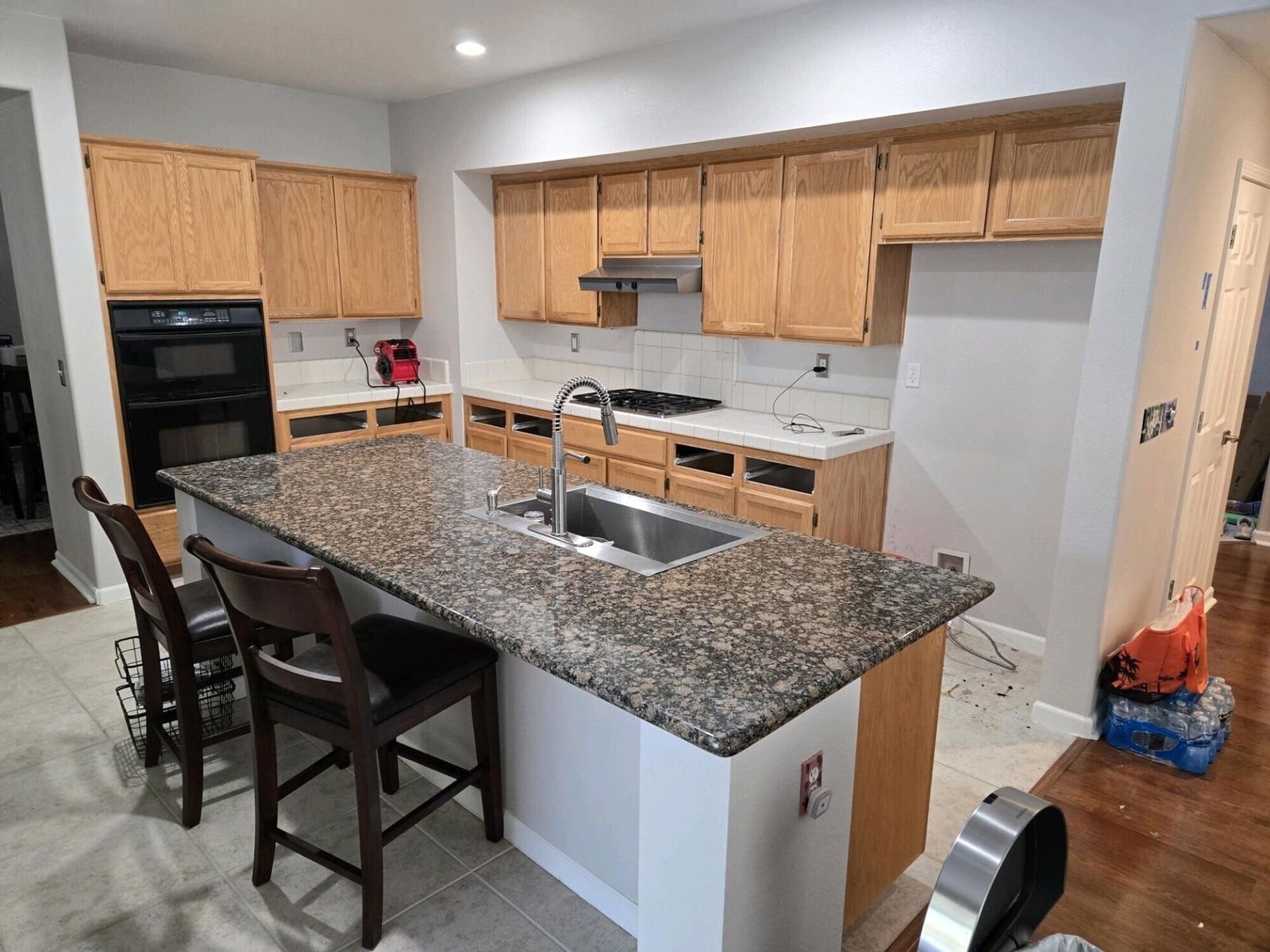 Oak kitchen refaced in white, before